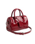 CILYON Sac Croc Mini Duffle in rouge croc leather with silver hardware — three-quarter view with shoulder strap