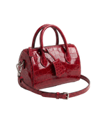 CILYON Sac Croc Mini Duffle in rouge croc leather with silver hardware — three-quarter view with shoulder strap